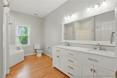 A beautifully updated brick home nestled on a peaceful corner on Kings Grant Golf and Country Club in North Carolina - for sale on GolfHomes.com, golf home, golf lot