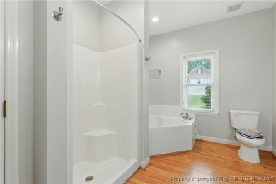 A beautifully updated brick home nestled on a peaceful corner on Kings Grant Golf and Country Club in North Carolina - for sale on GolfHomes.com, golf home, golf lot