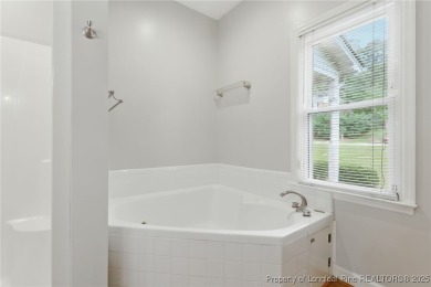 A beautifully updated brick home nestled on a peaceful corner on Kings Grant Golf and Country Club in North Carolina - for sale on GolfHomes.com, golf home, golf lot