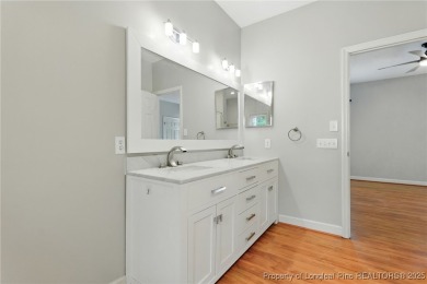 A beautifully updated brick home nestled on a peaceful corner on Kings Grant Golf and Country Club in North Carolina - for sale on GolfHomes.com, golf home, golf lot