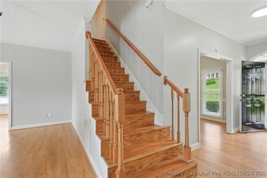 A beautifully updated brick home nestled on a peaceful corner on Kings Grant Golf and Country Club in North Carolina - for sale on GolfHomes.com, golf home, golf lot