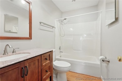 A beautifully updated brick home nestled on a peaceful corner on Kings Grant Golf and Country Club in North Carolina - for sale on GolfHomes.com, golf home, golf lot