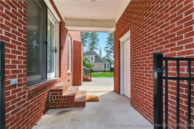 A beautifully updated brick home nestled on a peaceful corner on Kings Grant Golf and Country Club in North Carolina - for sale on GolfHomes.com, golf home, golf lot