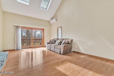 Stunning Cedar Chalet on the 15th Fairway of Paupack Hills in on Paupack Hills Golf and Country Club in Pennsylvania - for sale on GolfHomes.com, golf home, golf lot
