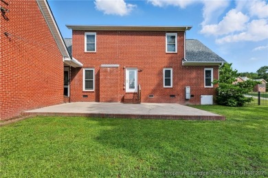 A beautifully updated brick home nestled on a peaceful corner on Kings Grant Golf and Country Club in North Carolina - for sale on GolfHomes.com, golf home, golf lot
