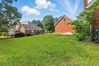 A beautifully updated brick home nestled on a peaceful corner on Kings Grant Golf and Country Club in North Carolina - for sale on GolfHomes.com, golf home, golf lot