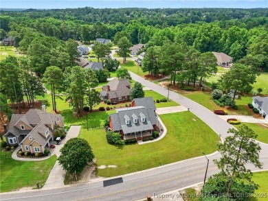 A beautifully updated brick home nestled on a peaceful corner on Kings Grant Golf and Country Club in North Carolina - for sale on GolfHomes.com, golf home, golf lot