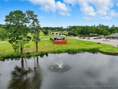 A beautifully updated brick home nestled on a peaceful corner on Kings Grant Golf and Country Club in North Carolina - for sale on GolfHomes.com, golf home, golf lot