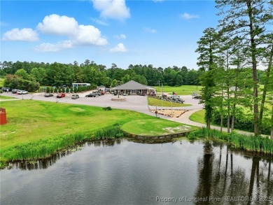 A beautifully updated brick home nestled on a peaceful corner on Kings Grant Golf and Country Club in North Carolina - for sale on GolfHomes.com, golf home, golf lot