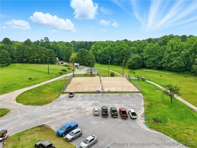 A beautifully updated brick home nestled on a peaceful corner on Kings Grant Golf and Country Club in North Carolina - for sale on GolfHomes.com, golf home, golf lot