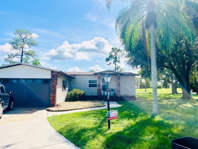 This stunning two-bedroom, two-bathroom home in Pine Lakes on Pine Lakes Country Club in Florida - for sale on GolfHomes.com, golf home, golf lot