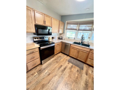 This stunning two-bedroom, two-bathroom home in Pine Lakes on Pine Lakes Country Club in Florida - for sale on GolfHomes.com, golf home, golf lot