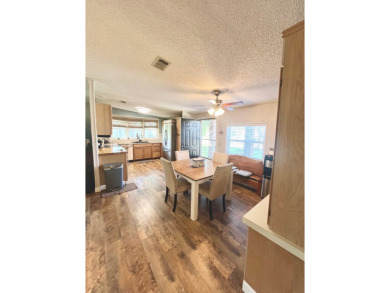 This stunning two-bedroom, two-bathroom home in Pine Lakes on Pine Lakes Country Club in Florida - for sale on GolfHomes.com, golf home, golf lot