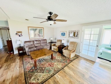 This stunning two-bedroom, two-bathroom home in Pine Lakes on Pine Lakes Country Club in Florida - for sale on GolfHomes.com, golf home, golf lot