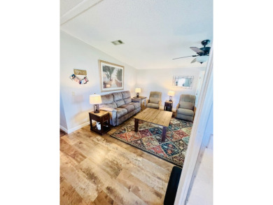 This stunning two-bedroom, two-bathroom home in Pine Lakes on Pine Lakes Country Club in Florida - for sale on GolfHomes.com, golf home, golf lot