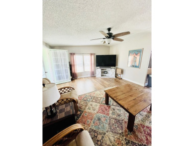 This stunning two-bedroom, two-bathroom home in Pine Lakes on Pine Lakes Country Club in Florida - for sale on GolfHomes.com, golf home, golf lot