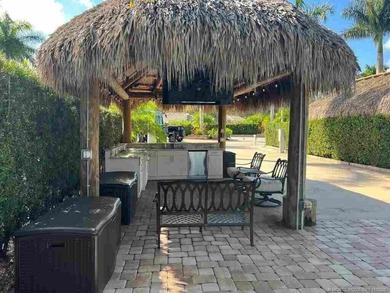 Peaceful Waterfront Lot with Tropical Views and Cozy Tiki on St. Lucie Trail Golf Club in Florida - for sale on GolfHomes.com, golf home, golf lot