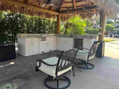 Peaceful Waterfront Lot with Tropical Views and Cozy Tiki on St. Lucie Trail Golf Club in Florida - for sale on GolfHomes.com, golf home, golf lot