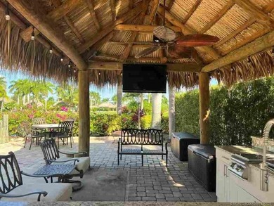 Peaceful Waterfront Lot with Tropical Views and Cozy Tiki on St. Lucie Trail Golf Club in Florida - for sale on GolfHomes.com, golf home, golf lot