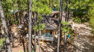 Escape to this adorable, remodeled 3 bedroom 2 bath cabin on Pinetop Lakes Country Club in Arizona - for sale on GolfHomes.com, golf home, golf lot