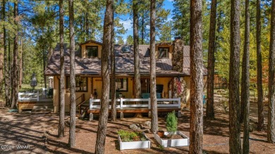 Escape to this adorable, remodeled 3 bedroom 2 bath cabin on Pinetop Lakes Country Club in Arizona - for sale on GolfHomes.com, golf home, golf lot