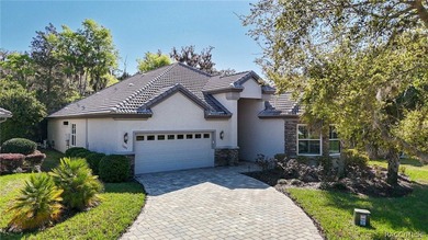 THIS GORGEOUS CUSTOM HOME welcomes you with an intricately on Skyview At Terra Vista Golf and Country Club in Florida - for sale on GolfHomes.com, golf home, golf lot