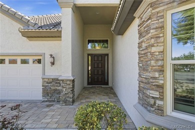 THIS GORGEOUS CUSTOM HOME welcomes you with an intricately on Skyview At Terra Vista Golf and Country Club in Florida - for sale on GolfHomes.com, golf home, golf lot