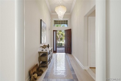 THIS GORGEOUS CUSTOM HOME welcomes you with an intricately on Skyview At Terra Vista Golf and Country Club in Florida - for sale on GolfHomes.com, golf home, golf lot