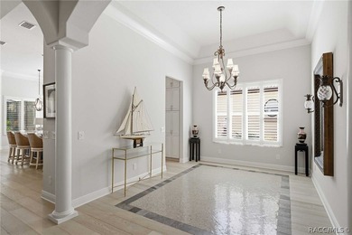 THIS GORGEOUS CUSTOM HOME welcomes you with an intricately on Skyview At Terra Vista Golf and Country Club in Florida - for sale on GolfHomes.com, golf home, golf lot