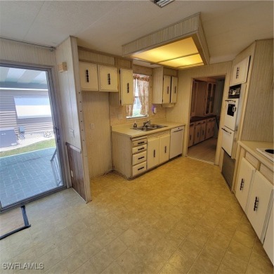 A little TLC could go along way here. Over 1300 sqft of living on Six Lakes Country Club in Florida - for sale on GolfHomes.com, golf home, golf lot