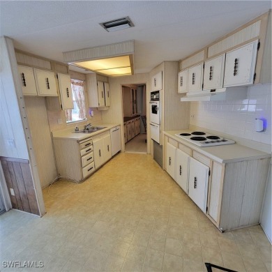 A little TLC could go along way here. Over 1300 sqft of living on Six Lakes Country Club in Florida - for sale on GolfHomes.com, golf home, golf lot