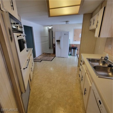 A little TLC could go along way here. Over 1300 sqft of living on Six Lakes Country Club in Florida - for sale on GolfHomes.com, golf home, golf lot