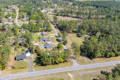 This charming 3-bedroom, 2-bath home located in the Starke Golf on Starke Golf and Country Club in Florida - for sale on GolfHomes.com, golf home, golf lot