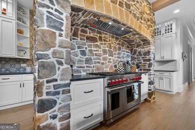 Welcome to this beautiful custom-built, 4-bedroom, 4.5-bath lake on Reynolds Lake Oconee - The Oconee in Georgia - for sale on GolfHomes.com, golf home, golf lot