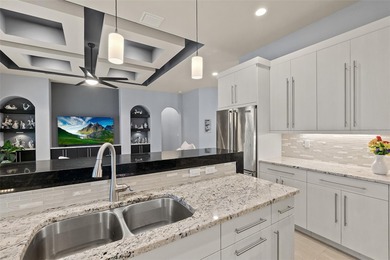 Welcome to this beautifully appointed 3-bedroom, 2-bath home on Plantation Bay Golf and Country Club in Florida - for sale on GolfHomes.com, golf home, golf lot