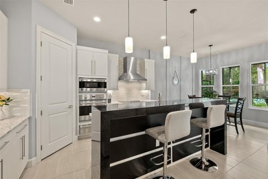 Welcome to this beautifully appointed 3-bedroom, 2-bath home on Plantation Bay Golf and Country Club in Florida - for sale on GolfHomes.com, golf home, golf lot