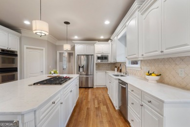 Experience luxury living at its finest in this stunning on Alpharetta Athletic Club East in Georgia - for sale on GolfHomes.com, golf home, golf lot