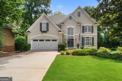 Tucked into a quiet cul-de-sac in sought-after Windward, this on The Golf Club of Georgia in Georgia - for sale on GolfHomes.com, golf home, golf lot