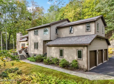 Set on 1.46 acres in Tanglwood Lakes, this 3,310-SF PRIVATE on Paupack Hills Golf and Country Club in Pennsylvania - for sale on GolfHomes.com, golf home, golf lot