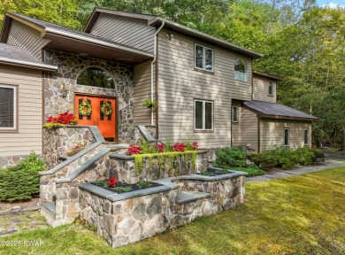 Set on 1.46 acres in Tanglwood Lakes, this 3,310-SF PRIVATE on Paupack Hills Golf and Country Club in Pennsylvania - for sale on GolfHomes.com, golf home, golf lot