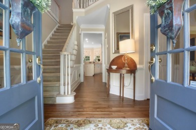 Tucked into a quiet cul-de-sac in sought-after Windward, this on The Golf Club of Georgia in Georgia - for sale on GolfHomes.com, golf home, golf lot