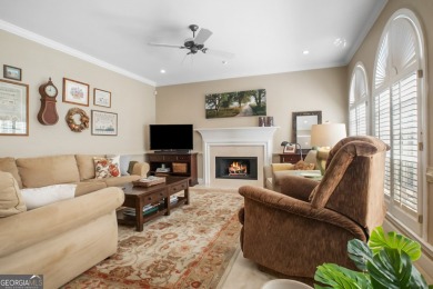 Tucked into a quiet cul-de-sac in sought-after Windward, this on The Golf Club of Georgia in Georgia - for sale on GolfHomes.com, golf home, golf lot