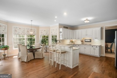 Tucked into a quiet cul-de-sac in sought-after Windward, this on The Golf Club of Georgia in Georgia - for sale on GolfHomes.com, golf home, golf lot