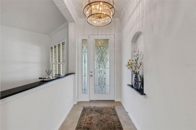 THIS POPULAR DORCHESTER plan home in the Laurel Glen community on Grasslands Golf and Country Club in Florida - for sale on GolfHomes.com, golf home, golf lot