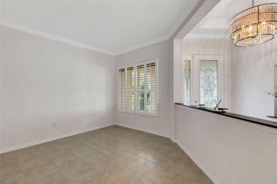 THIS POPULAR DORCHESTER plan home in the Laurel Glen community on Grasslands Golf and Country Club in Florida - for sale on GolfHomes.com, golf home, golf lot