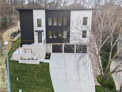 This exquisite custom home on a quiet cul-de-sac in The National on The Deuce At the National Golf Club of Kansas City in Missouri - for sale on GolfHomes.com, golf home, golf lot