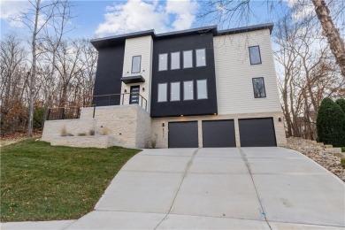 This exquisite custom home on a quiet cul-de-sac in The National on The Deuce At the National Golf Club of Kansas City in Missouri - for sale on GolfHomes.com, golf home, golf lot