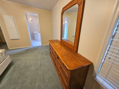 This home is on leased land. Buyers do not own the land. This on Big Cypress Golf and Country Club in Florida - for sale on GolfHomes.com, golf home, golf lot