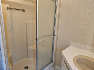This home is on leased land. Buyers do not own the land. This on Big Cypress Golf and Country Club in Florida - for sale on GolfHomes.com, golf home, golf lot