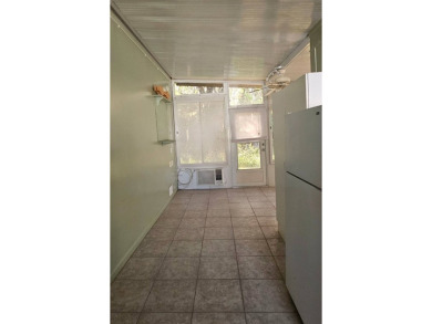This home is on leased land. Buyers do not own the land. This on Big Cypress Golf and Country Club in Florida - for sale on GolfHomes.com, golf home, golf lot